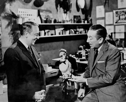 Walt Disney shows off Jose, the MC audio-animatronic bird friend from the Enchanted Tiki Room.