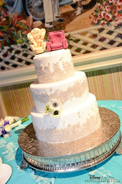 A beautiful wedding cake is made even more special by Carl and Ellie's chairs from up. Yes, there's a tear in our eye.