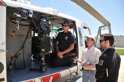 Director Bobs Gannaway and Producer Ferrell Barron are shown one of Cal Fire’s helicopters.