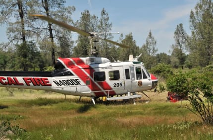 A Cal Fire Super Huey helicopter prepares to take off.