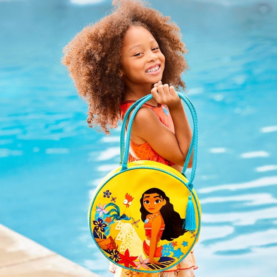 Colorful Disney Princess-themed swimwear, bag pictured