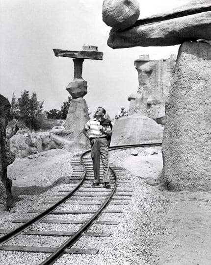 Walt stands on the train tracks that pass through Balancing Rock Canyon.