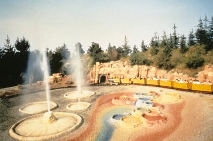 A train travels through paint pots and geysers.
