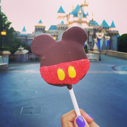 This Disney dessert is the perfect portable sweet treat (and extremely Instagram-able). Much like its distant on-a-stick cousin, the corn dog, it’s great to tote around the park. And complements any outfit. The perfect accessory! Take a bite at: Disneyland Resort and Walt Disney World Resort