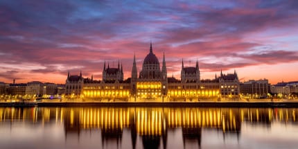 adventures by disney europe danube river cruise itinerary hero 02 budapest parlament building illumination cruise
