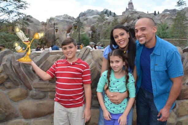 Disney PhotoPass Magic Shot with Lumiere in front of Beasts enchanted castle at Magic Kingdom Park