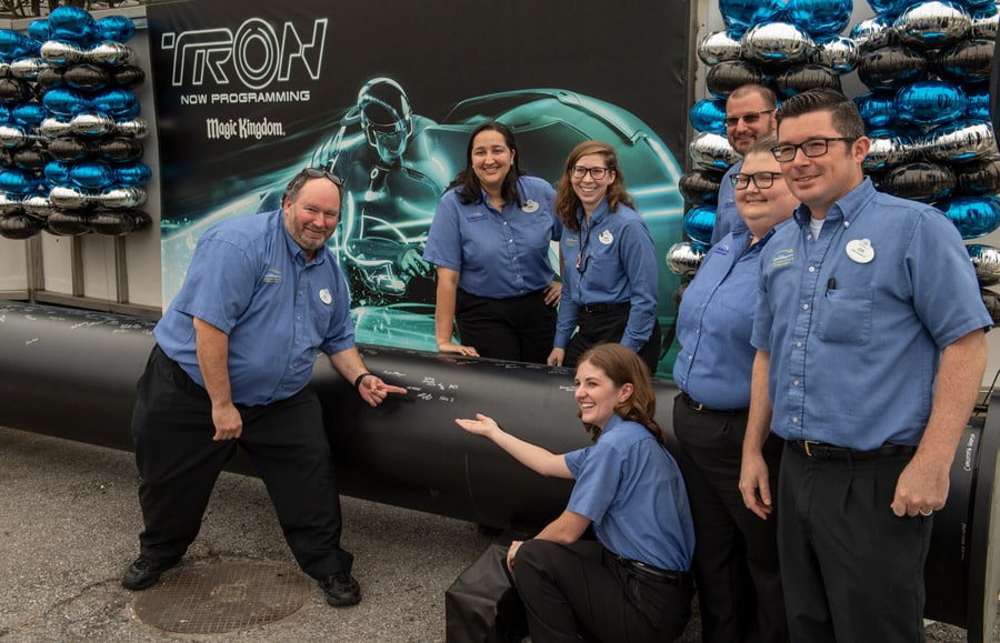 TRON attraction construction milestone at Magic Kingdom park cast members sign name on first steel support columns for the new attraction