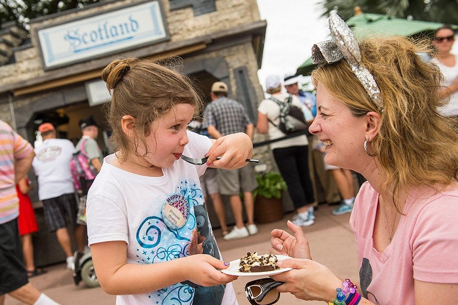 Trying food at the Epcot International Food & Wine Festival