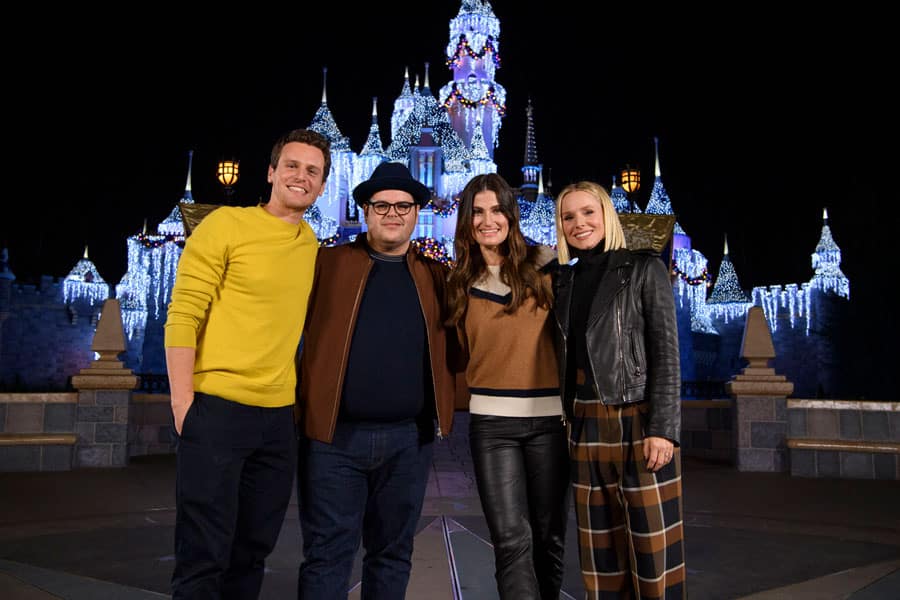 Kristen Bell, Idina Menzel, Jonathan Groff and Josh Gad pose in front of Sleeping Beauty Castle at Disneyland park