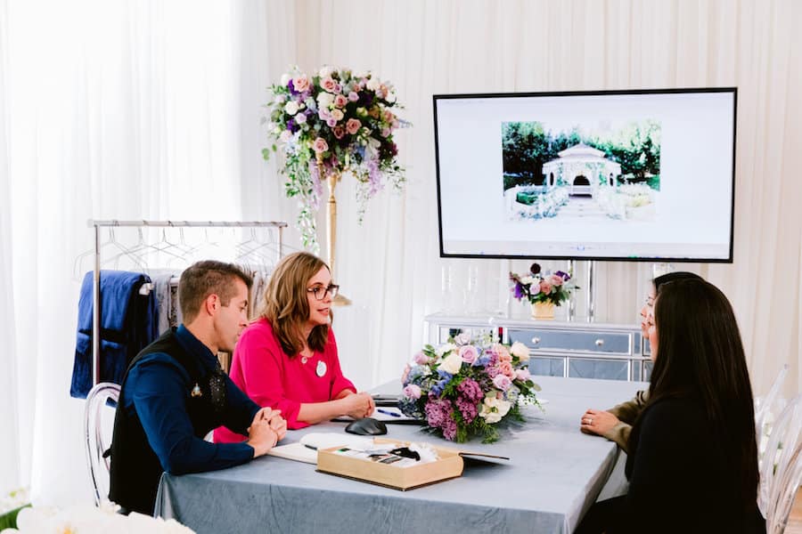 Couple meeting with Disney Weddings team