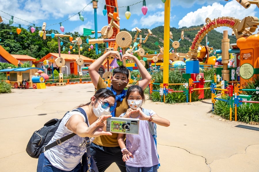 Guests take a selfie at Hong Kong Disneyland