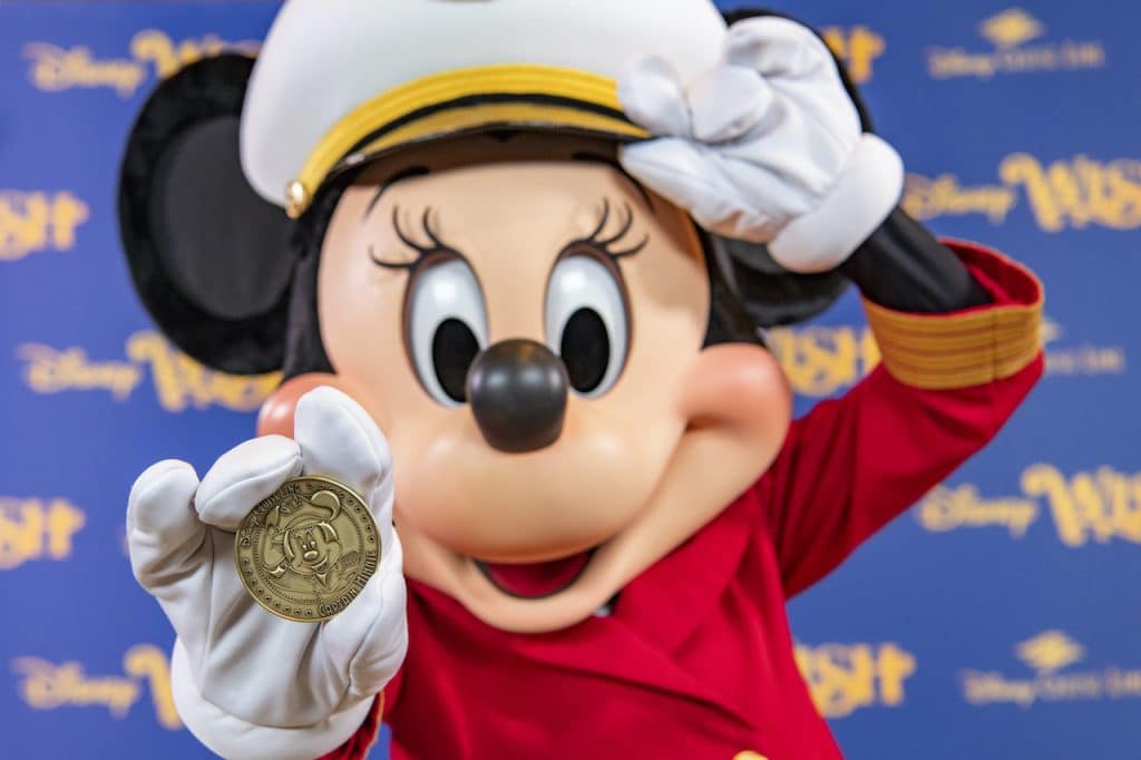 Minted coin featuring Captain Minnie Mouse that is placed under the keel of the new Disney Wish