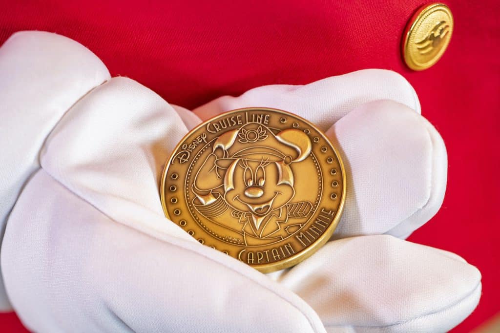 Close up of the minted coin featuring Captain Minnie Mouse that is placed under the keel of the new Disney Wish