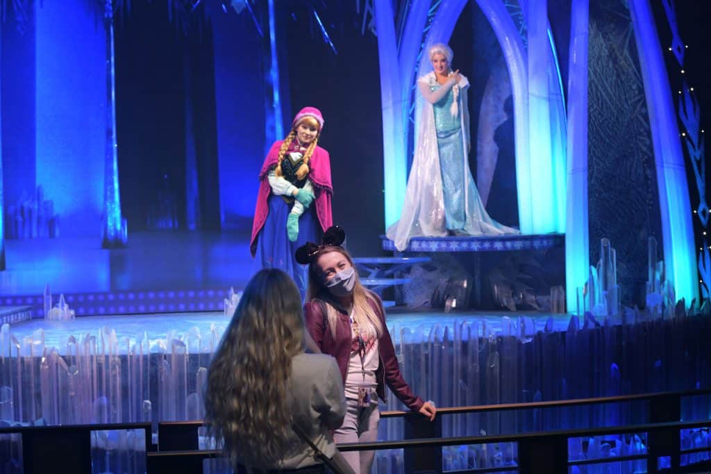 Guests taking a photo with Anna and Elsa at Disneyland Paris