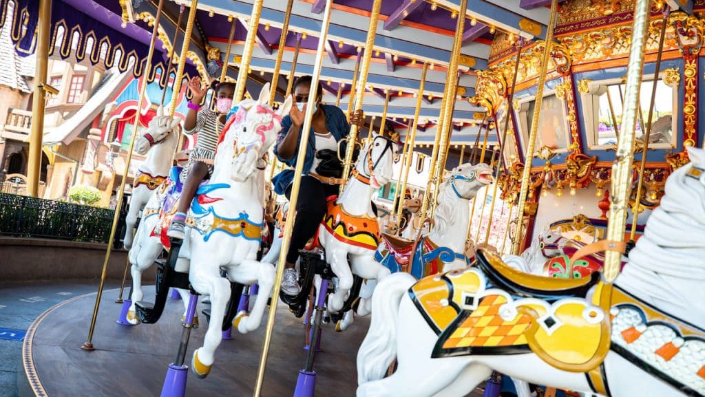 Guests on King Arthur Carrousel as Disneyland Park