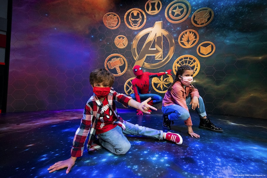 Kids meeting their friendly neighborhood Spider Man at the Super Hero Station at Disneys Hotel New York The Art of Marvel