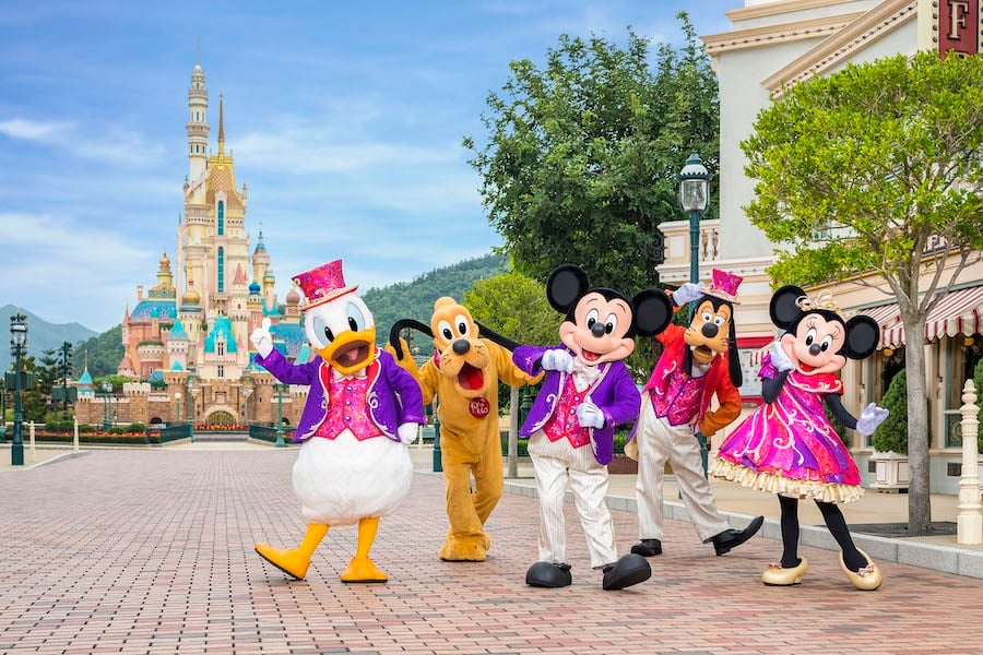 Mickey Mouse and friends in front of Castle of Magical Dreams in Hong Kong Disneyland