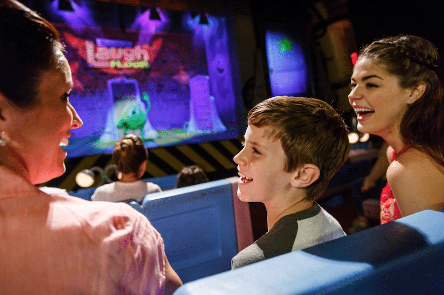 Family enjoying Monsters, Inc. Laugh Floor at Magic Kingdom Park