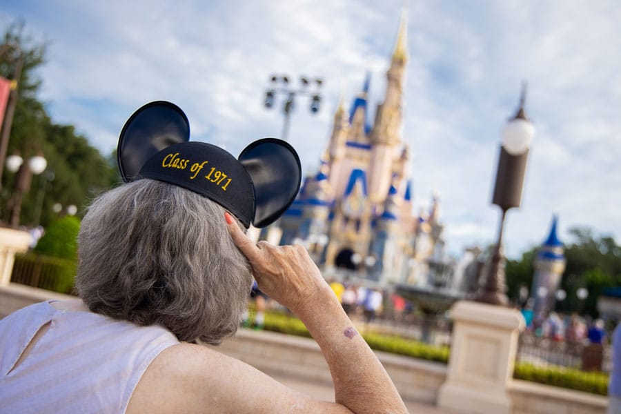 A cast member shows off their new Class of 1971 Mickey ears.