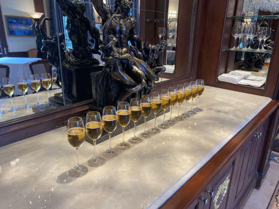 13 champagne flutes for fallen soldiers