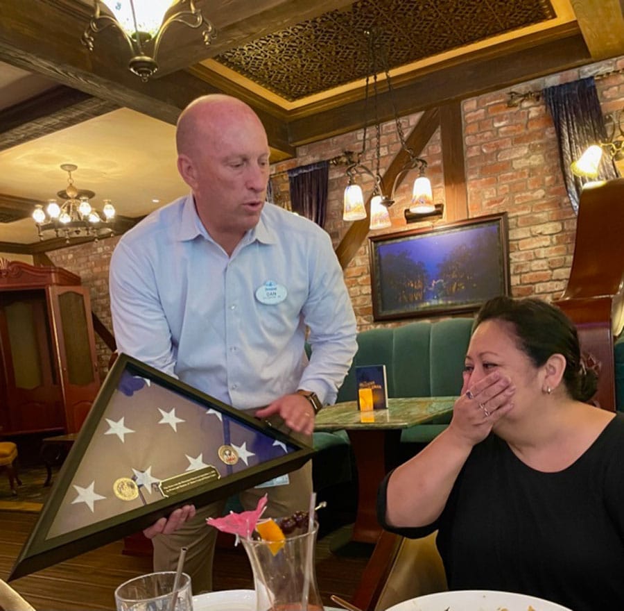 Lopez family presented with framed American flag