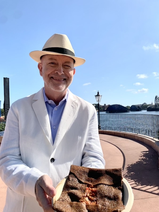 Chef Bill Yosses trying the Ratatouille Galette at EPCOT