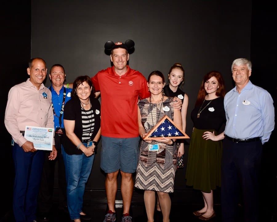 2017 Photo of Alex with EPCOT cast members including Javier Rossy, Mallory Ledet and Hannah Blatt who coordinated a surprise reunion with his family following a long military deployment overseas.
