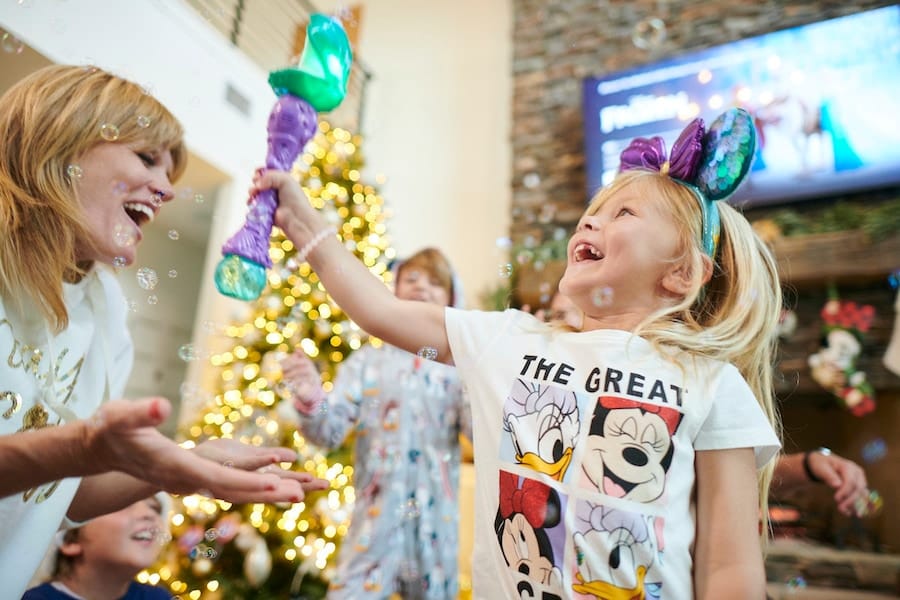 Family playing with gifts from Disney Springs