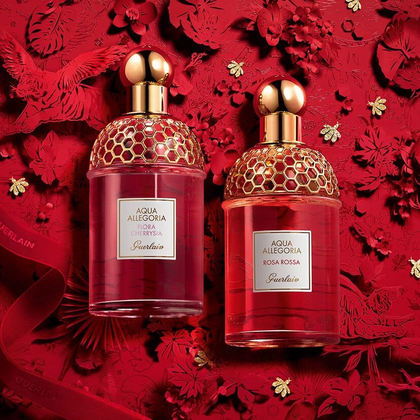 two bottles of perfume with valentine's day themed designs