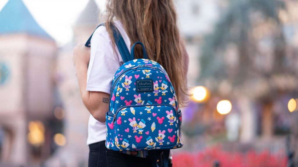 blue loungefly backpack with Donald and Daisy Duck