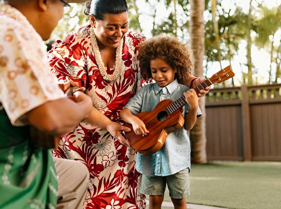 Guest leaning how to play the ukulele at Aunty’s Beach House