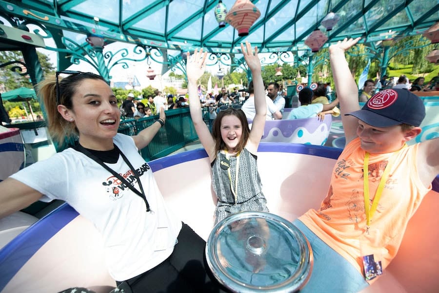 Disney VoluntEAR, young patients and families enjoying attractions at Disneyland Paris