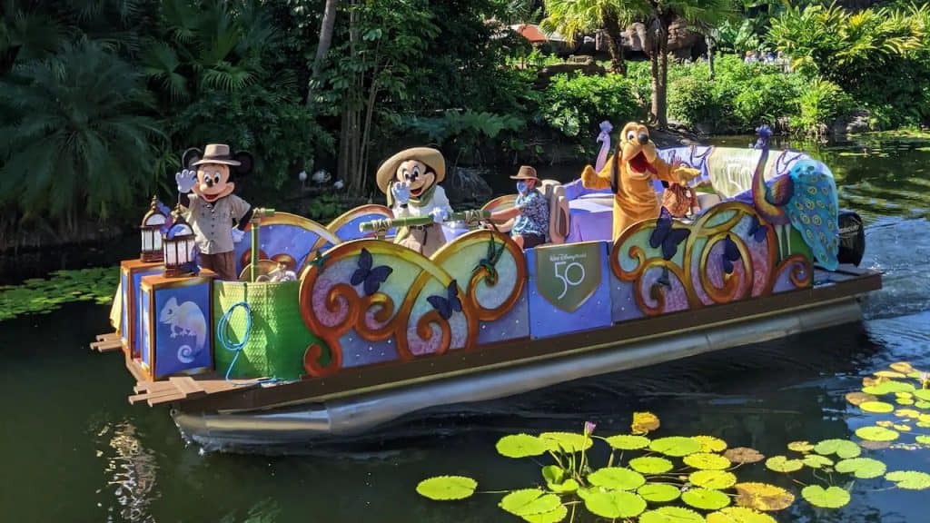 Mickey Mouse, Minnie Mouse and Pluto on a flotilla at Disney's Animal Kingdom