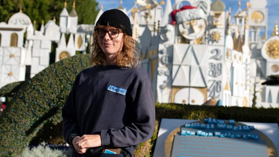 Park Decorator and Designer Cassandra Siemon in front of "it's a small world"