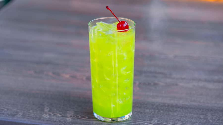 Melon Cocktail: Tequila, melon liqueur, fresh lemon juice, and orgeat topped with a cherry