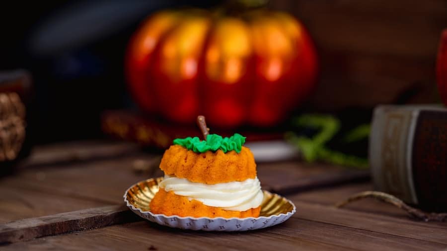 Pumpkin Bundt Cake: Pumpkin-flavored cake filled with dulce de leche and cream cheese frosting finished with chocolate stem and mousse leaf - Cappuccino Cart in Disney California Adventure Park