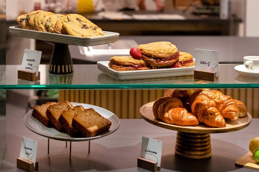 Sketch Pad Café at Pixar Place Hotel featuring baked goods, cookies, croissant and more