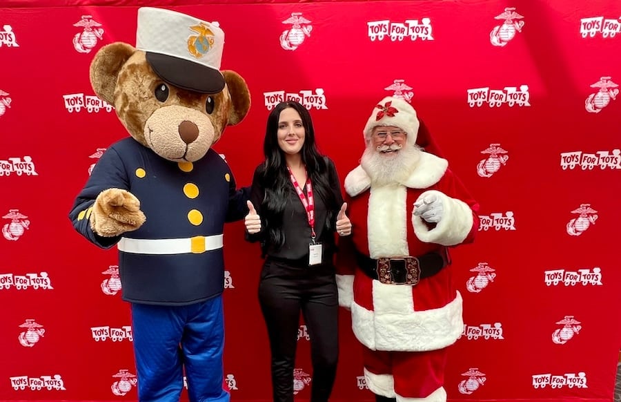 Volunteer is Taylor Price with Santa