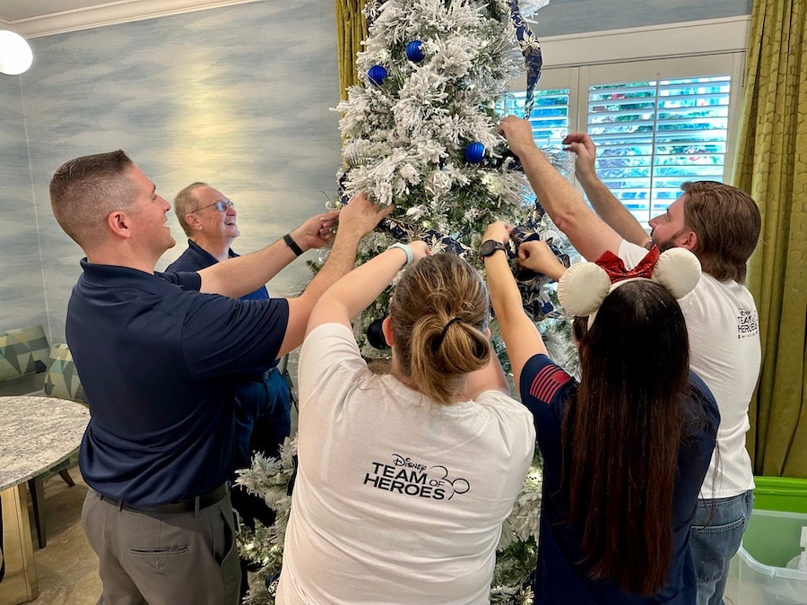 Disney SALUTE VoluntEARS decorate tree