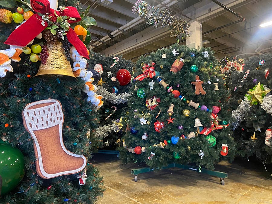 A Disney Christmas tree disassembled into pieces in the Holiday Services warehouse.