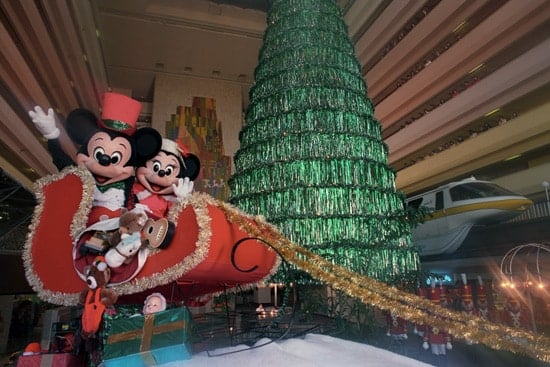 Mickey Mouse and Minnie Mouse in a red sleigh during Christmastime at Disney’s Contemporary Resort in 1989