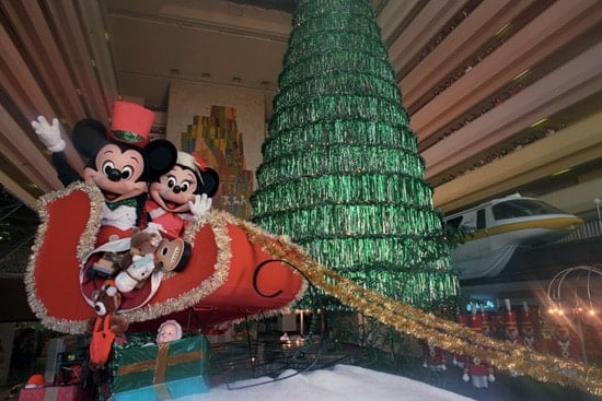 Mickey Mouse and Minnie Mouse in a red sleigh during Christmastime at Disneys Contemporary Resort in 1989