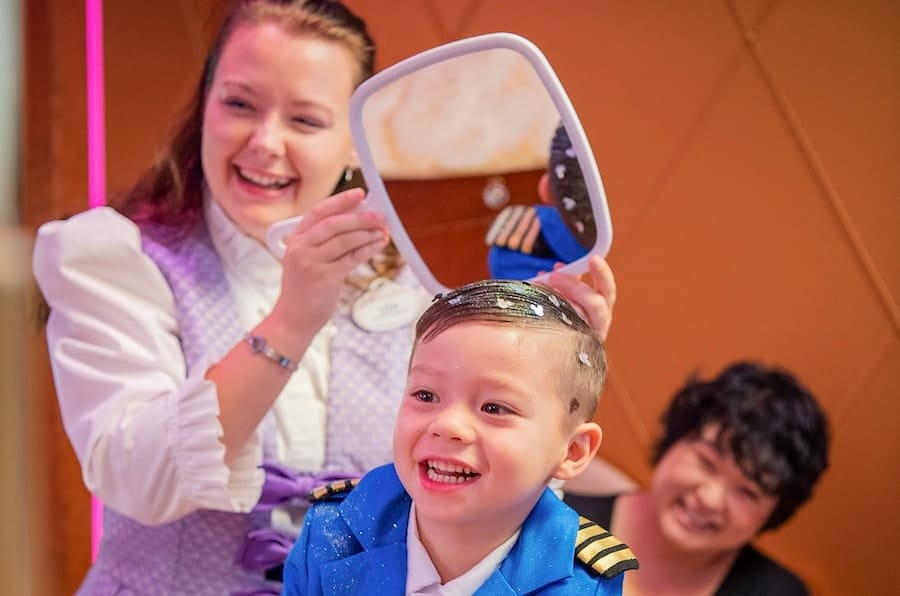 A child getting a makeover at Bibbidi Bobbidi Boutique on a Disney Cruise Line ship