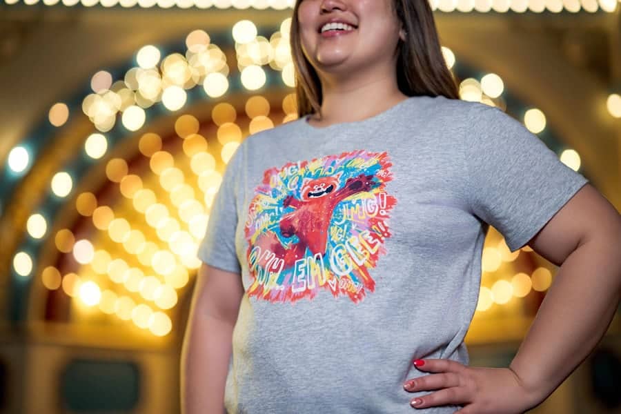 a woman wearing Pixar Fest merchandise Turning Red tshirt