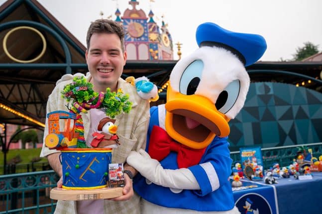 | The Main Street Mouse a Cast Member Poses with Donald Duck