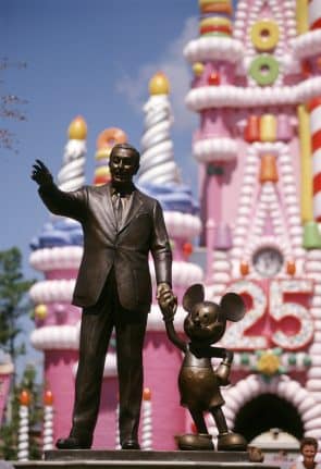 Partners Statue in front of the 25th anniversary "birthday cake" Cinderella Castle