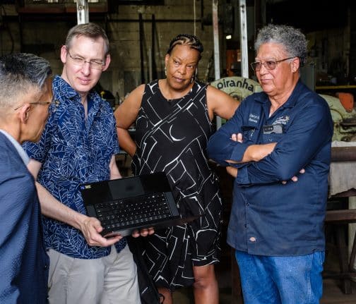 Imagineers Charita Carter Dustin Eshenroder and Ted Robledo visit with local blacksmith Darryl Reeves in Louisiana