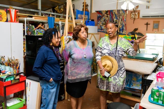 Carmen Smith senior vice president Creative Development ProductContent Inclusive Strategies fellow Imagineer Charita Carter and local artist Malaika Favorite discuss Tiana's Bayou Adventure
