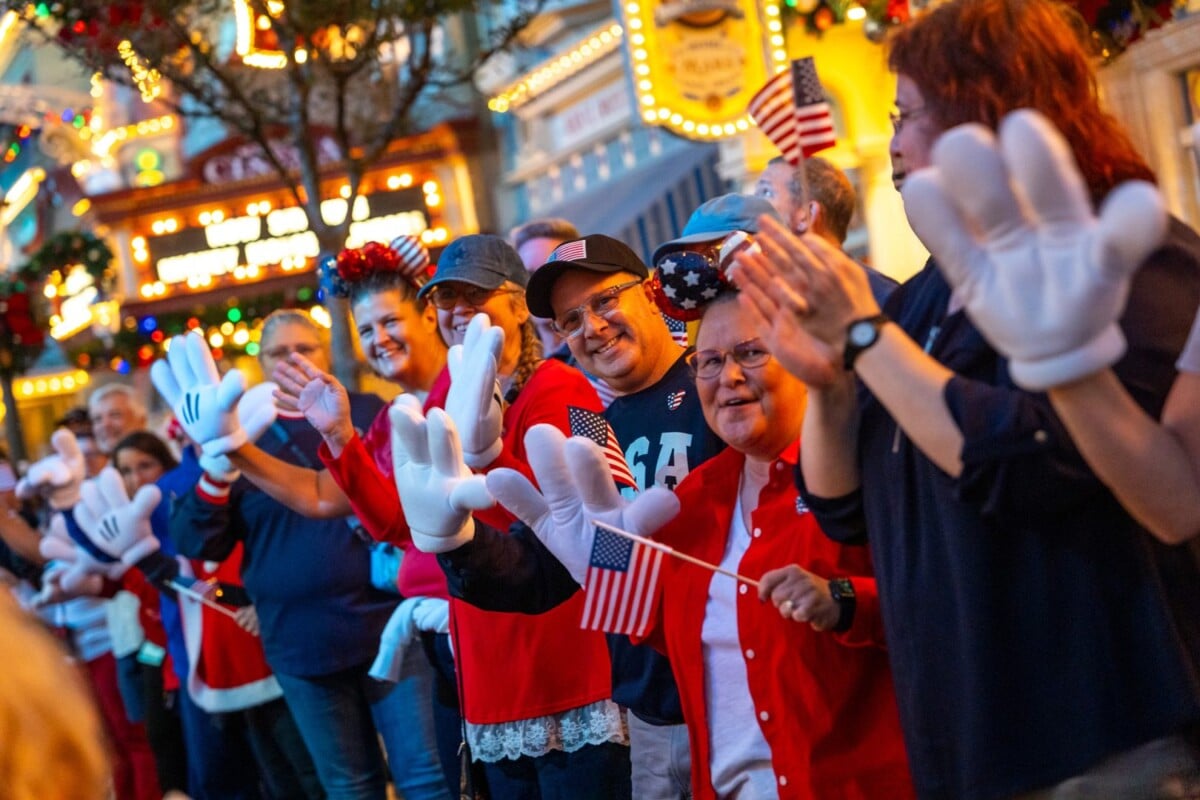 Cast members cheer for families on Main Street USA
