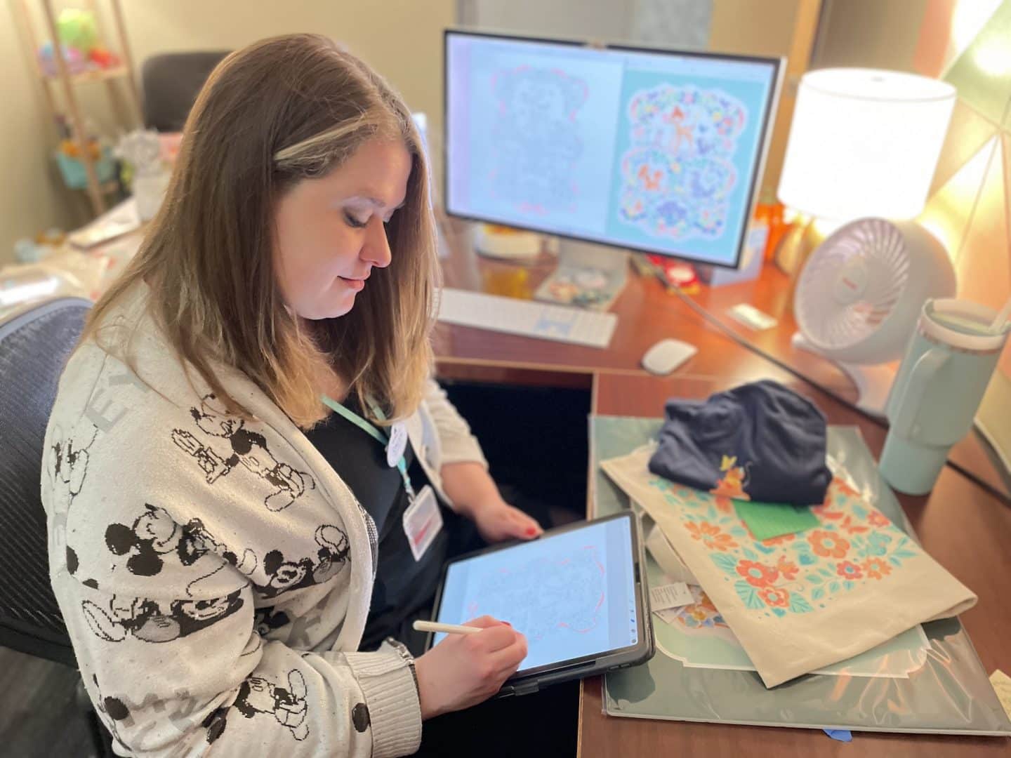 | The Main Street Mouse Disney Cast Member Working on Artwork for Epcot International Festival of the Arts Merchandise